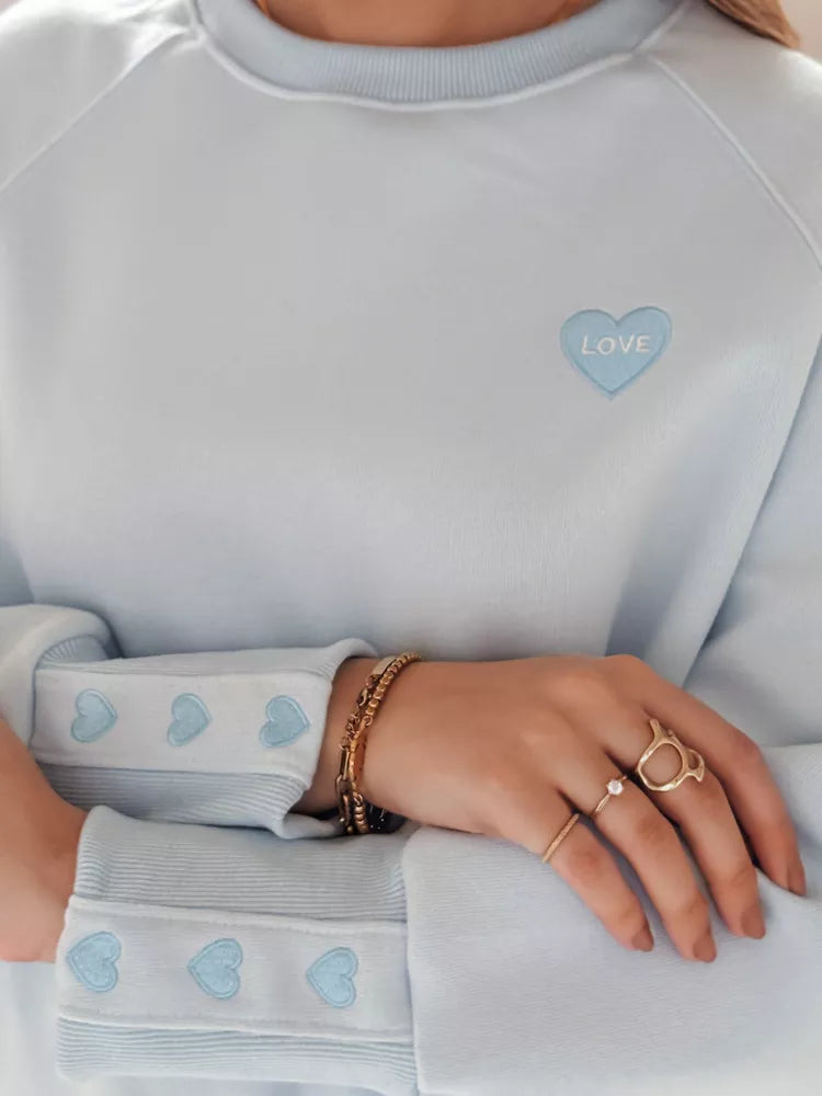 Moteriškas šviesiai mėlynos spalvos džemperis Love